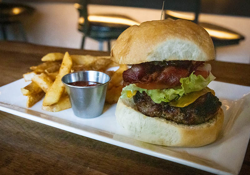 Gourmet burger and fries at Simon's on the Square Bolivar, TN restaurant and bar
